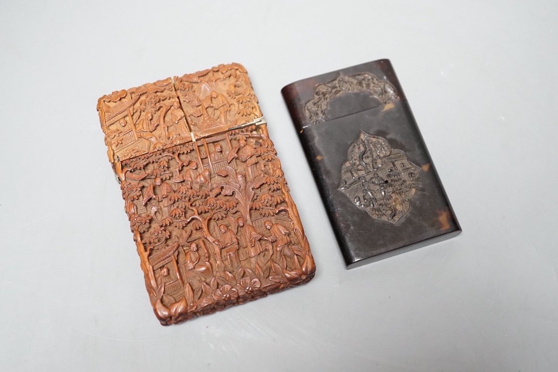 A 19th century Chinese tortoiseshell card case and a similar carved sandalwood card case, 11 cms high x 7 cms wide.